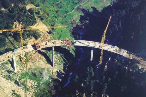 <div style="text-align:center; color:white;"><div style="font-size:17px; ">Bridge over the Teixeira River</div><br>Client: Câmaras Municipais de Baião e Resende<br>Year: 1996 – 1998</div>